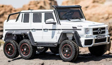 Load image into Gallery viewer, Large 24V Mercedes Benz G63 6x6 w/ Leather Seats &amp; Rubber Tires, Remote Control, Sound system and more! (White Colour) Ride On Cars FREDDO 
