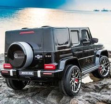 Load image into Gallery viewer, **Pre Order Ships July 30th** Large 24V Mercedes Benz G Wagon G63 AMG 4x4 with upgraded Leather seats, Bluetooth, 4 motors, Remote control &amp; More! (Black) Ride On Cars FREDDO 
