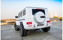 Load image into Gallery viewer, **Pre Order Ships July 30** 24V Large Mercedes Benz G Wagon G63 AMG 4x4 with upgraded Leather seats, Bluetooth, 4 motors, Remote control &amp; More! (White) Ride On Cars FREDDO 
